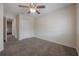 Bedroom featuring a ceiling fan, carpet flooring and closet at 3073 Overlook Pl, Clearwater, FL 33760