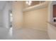 Open dining room with tile flooring and view of the staircase at 3073 Overlook Pl, Clearwater, FL 33760