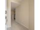 Bright entryway with neutral paint, light tile floor, and a view of the kitchen at 3073 Overlook Pl, Clearwater, FL 33760