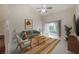 Living room with ceiling fan and sliding glass doors to patio at 3073 Overlook Pl, Clearwater, FL 33760