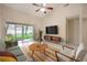 Living room with vaulted ceilings and sliding doors that lead to the lanai at 3073 Overlook Pl, Clearwater, FL 33760