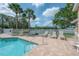 Featuring a community pool with a 3 ft depth, complemented by comfortable seating at 3073 Overlook Pl, Clearwater, FL 33760