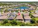 Located next to a lake! Aerial view of a home in a well-planned community surrounded by picturesque landscapes and serene waterfronts at 31050 Spruceberry Ct, Wesley Chapel, FL 33543