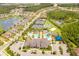 Aerial view of community amenities including pool, tennis courts, splash pad and clubhouse at 31050 Spruceberry Ct, Wesley Chapel, FL 33543