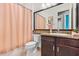 The bathroom features tile flooring, a vanity with granite countertop and a shower with curtain at 31050 Spruceberry Ct, Wesley Chapel, FL 33543