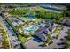 Aerial shot of community amenities featuring a pool, tennis courts, and recreational areas at 31050 Spruceberry Ct, Wesley Chapel, FL 33543