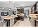 Open kitchen with stainless steel appliances, granite countertops, and seamless view to the living room at 31050 Spruceberry Ct, Wesley Chapel, FL 33543