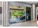 Beautiful covered patio with outdoor seating and lush greenery, creating a relaxing outdoor living space at 31050 Spruceberry Ct, Wesley Chapel, FL 33543