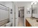 Bathroom featuring a toilet, shower with curtain, and a vanity sink at 3142 Stonegate Falls Dr, Land O Lakes, FL 34638