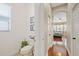 Comfortable half bathroom leading to the bedroom through a hallway with hardwood floors at 3142 Stonegate Falls Dr, Land O Lakes, FL 34638