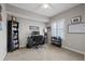 Neutral bedroom with ceiling fan and modern plantation shutters offering great natural light, perfect for home office at 3142 Stonegate Falls Dr, Land O Lakes, FL 34638