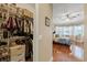 Walk-in closet with shelving, drawers, and access to the bedroom at 3142 Stonegate Falls Dr, Land O Lakes, FL 34638