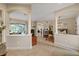 Spacious foyer with views into the living room, dining room, and pool area at 3142 Stonegate Falls Dr, Land O Lakes, FL 34638