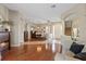 Spacious living room with hardwood floors, fireplace, dining room, and entrance foyer at 3142 Stonegate Falls Dr, Land O Lakes, FL 34638