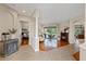 Open floor plan living area with hardwood floors and view of the backyard at 3142 Stonegate Falls Dr, Land O Lakes, FL 34638