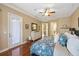 Spacious main bedroom with walk-out balcony, hardwood floors, and ensuite bathroom at 3142 Stonegate Falls Dr, Land O Lakes, FL 34638