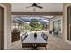 The screened patio with a dining table overlooks a beautiful pool, offering a serene outdoor living space at 3142 Stonegate Falls Dr, Land O Lakes, FL 34638
