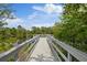 Beautiful community dock providing direct access to the pond for recreational activities and nature appreciation at 3142 Stonegate Falls Dr, Land O Lakes, FL 34638