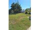 This property has a grass backyard, mature trees and is enclosed with a chain link fence at 361 Fairhaven St, Port Charlotte, FL 33952