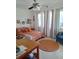 Bright bedroom with large windows, neutral tile floor, and a comfortable looking paisley comforter at 361 Fairhaven St, Port Charlotte, FL 33952