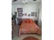 Cozy bedroom with a paisley comforter, a ceiling fan, decorative throw pillows and neutral tile floor at 361 Fairhaven St, Port Charlotte, FL 33952