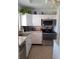 Efficient kitchen featuring stainless steel appliances and ample cabinet space at 361 Fairhaven St, Port Charlotte, FL 33952
