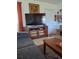 Living room with tile floors, and large TV at 361 Fairhaven St, Port Charlotte, FL 33952