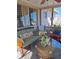 Inviting sunroom with comfortable seating, lots of windows, and plenty of plants at 361 Fairhaven St, Port Charlotte, FL 33952
