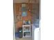 The utility room features a water heater and a washer next to cleaning supplies at 361 Fairhaven St, Port Charlotte, FL 33952