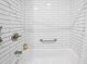 Close up of tile in modern shower over tub, featuring subway tile at 3711 W Dale Ave, Tampa, FL 33609