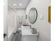 Bathroom featuring shower over tub, with subway tile and modern sink at 3711 W Dale Ave, Tampa, FL 33609