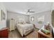 Well-lit bedroom with a ceiling fan and hardwood floors at 3711 W Dale Ave, Tampa, FL 33609