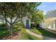 Charming home featuring a landscaped yard, welcoming entryway, and attached garage, perfect for curb appeal at 3711 W Dale Ave, Tampa, FL 33609