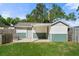 Detached two-car garage with covered parking and storage space in the backyard at 3711 W Dale Ave, Tampa, FL 33609
