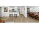 Open concept kitchen features stainless appliances, white cabinets, and modern design at 3711 W Dale Ave, Tampa, FL 33609