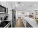 Modern kitchen with stainless steel appliances, breakfast bar, and subway tile backsplash offers updated features at 3711 W Dale Ave, Tampa, FL 33609