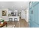 Modern kitchen features a breakfast bar, stainless steel appliances, and white cabinetry, ideal for cooking at 3711 W Dale Ave, Tampa, FL 33609