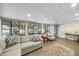 Open living space with lots of natural light, neutral decor and wood flooring at 3711 W Dale Ave, Tampa, FL 33609