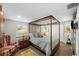 Cozy main bedroom featuring a canopy bed and lots of natural light at 3711 W Dale Ave, Tampa, FL 33609