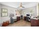 Bright home office with a ceiling fan and hardwood floors at 3711 W Dale Ave, Tampa, FL 33609