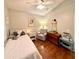 Relaxing bedroom featuring neutral tones, and a comfortable sitting area at 425 E Orange St, Tarpon Springs, FL 34689