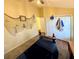 Neutral bedroom with hardwood floors, closet, and fan at 425 E Orange St, Tarpon Springs, FL 34689