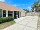 Lovely home featuring an attached garage, a long driveway, and a well-maintained lawn at 425 E Orange St, Tarpon Springs, FL 34689