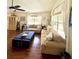Comfortable living room featuring hardwood floors, vaulted ceilings, and stylish furniture at 425 E Orange St, Tarpon Springs, FL 34689