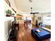 Open-concept living space with hardwood floors, vaulted ceilings, and stylish furnishings at 425 E Orange St, Tarpon Springs, FL 34689