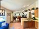 Spacious living space featuring an open floorplan, high ceilings, modern lighting, and wood and tile flooring at 425 E Orange St, Tarpon Springs, FL 34689