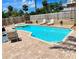 A refreshing swimming pool with a sun-soaked patio and comfortable lounge chairs awaits you at 425 E Orange St, Tarpon Springs, FL 34689