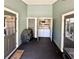 Back porch featuring a washer, dryer, and storage closets at 425 E Orange St, Tarpon Springs, FL 34689
