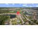 Aerial view of planned community with lakes, landscaped yards, and swimming pool at 4354 Barletta Ct, Wesley Chapel, FL 33543