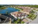 Stunning aerial of home within community, featuring lakes, community pool and landscaping at 4354 Barletta Ct, Wesley Chapel, FL 33543